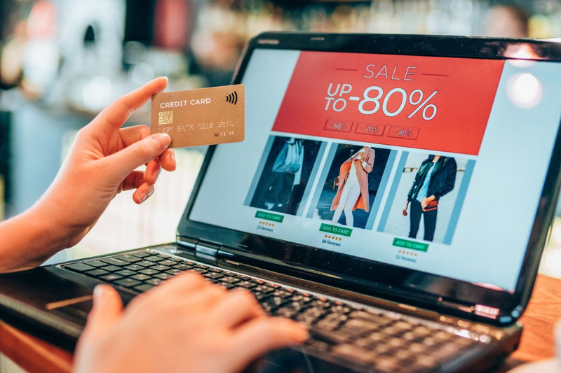 Online shopping on a laptop with a credit card