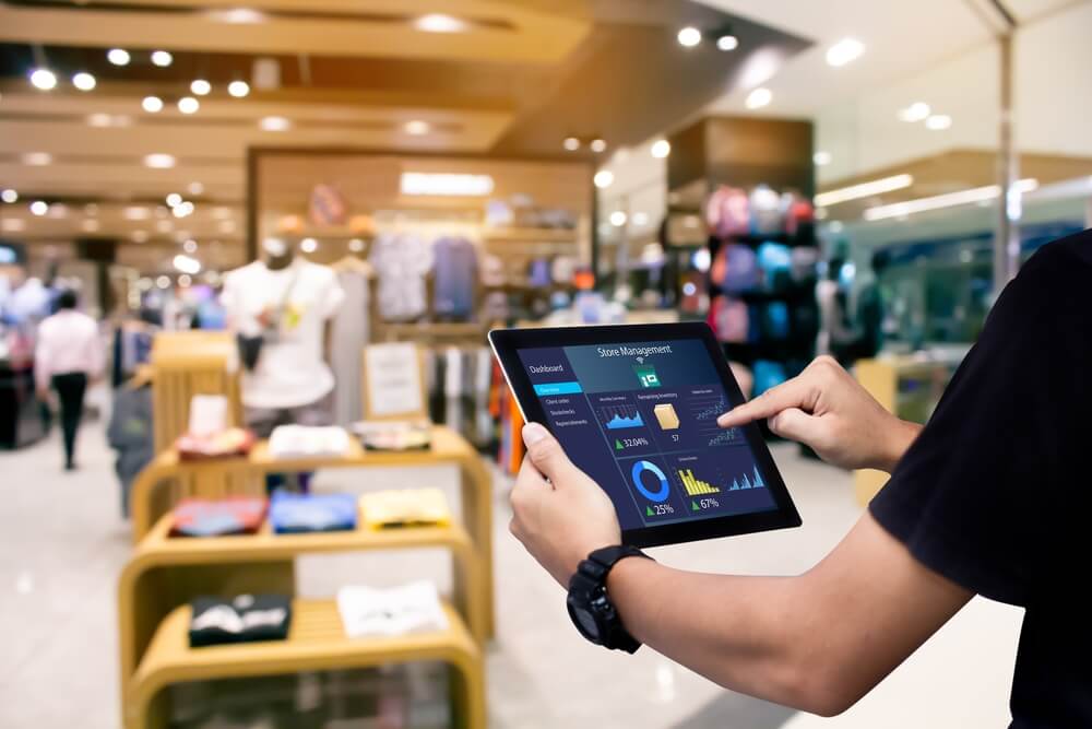 Retail associate using a tablet in a store