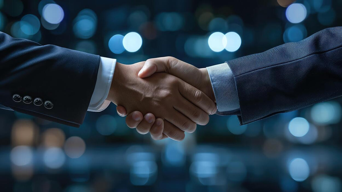Two business partners shaking hands
