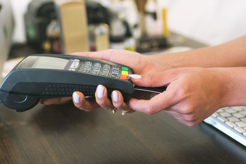 Customer paying with a card reader