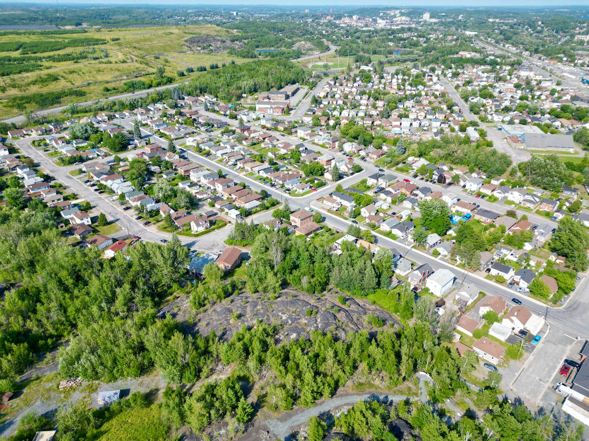 Aerial view of Sudbury, Ontario surrounded by trees