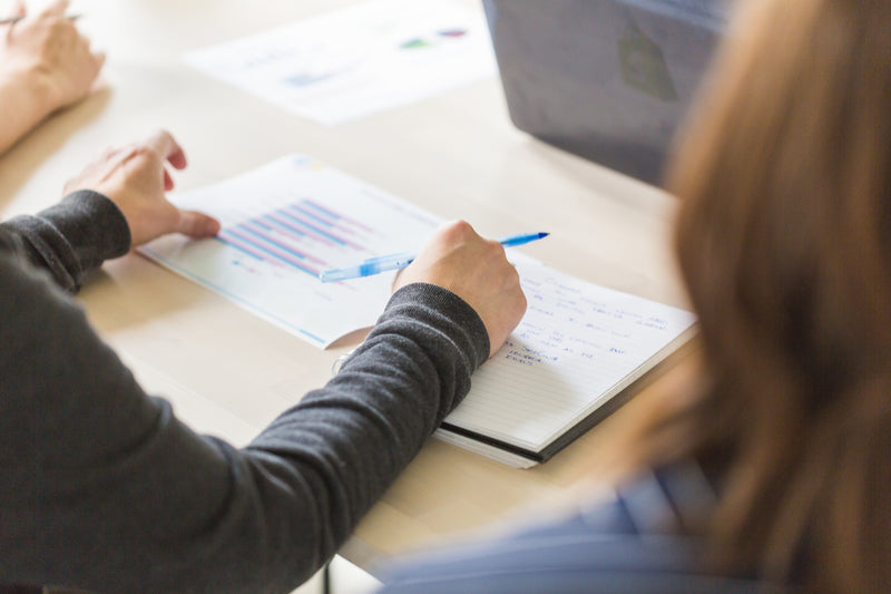 Taking notes at a team meeting
